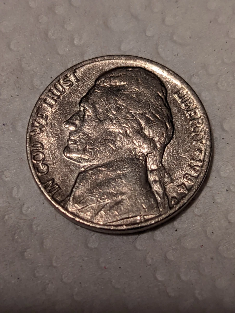 1984 Jefferson nickel struck on a clad dime planchet, showing the notably smaller diameter compared to a normal nickel